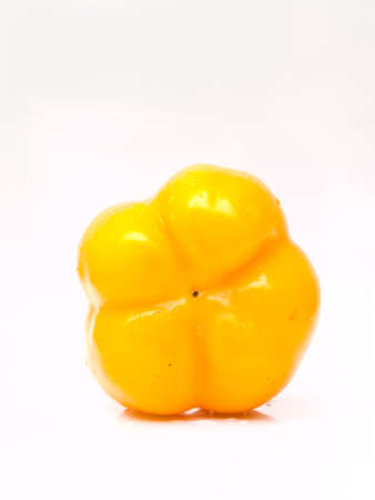 Fresh yellow bell pepper, Capsicum annuum, isolated on white backgroundの写真素材