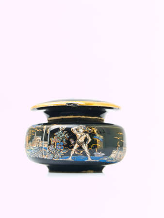 A black miniature ceramic jar painted by  tourist destinations in Rome, Italy isolated on white backgroundの写真素材