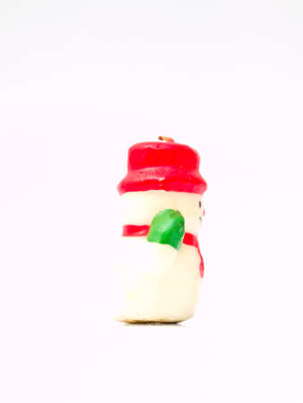 Side of christmas snow doll  candle isolated on white backgroundの写真素材