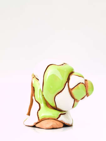 An escargot ceramic doll isolated on white backgroundの写真素材