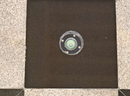 Black polished granite with lighting lamp texture as backgroundの写真素材