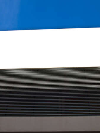 Building exterior wall and metal vertical fins as backgroundの写真素材