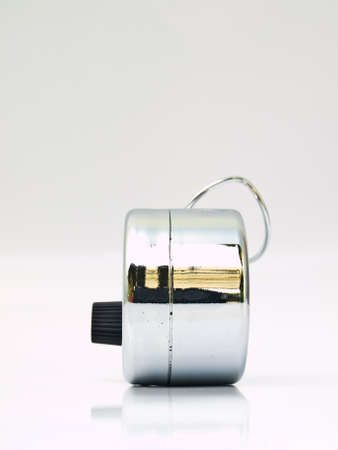 Hand held tally counter isolated on whiteの写真素材