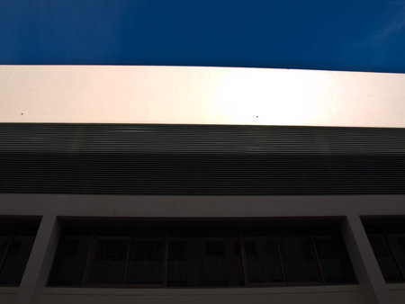 Building exterior wall and metal vertical fins as background