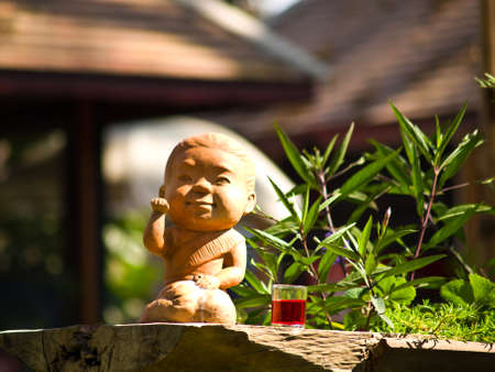 A potery of Thai welcoming girl ,Lucky girl, Cat Swipe, girl cat, or Fortune girlの写真素材