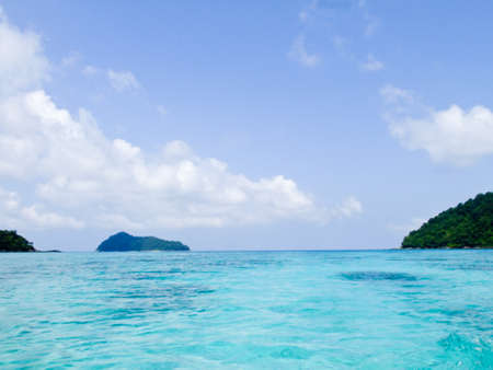 Crystal clear blue waters of the Andaman sea against blue sky in Surin Marine park, Phanga, Thailandの写真素材