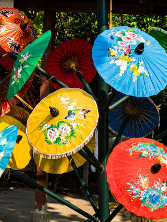 Colorful rice paper umbrella dried in nature. one of handmade souvenirs from Chiang  mai, Thailandの写真素材