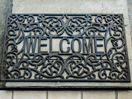 black wrought iron welcome rug in natureの写真素材