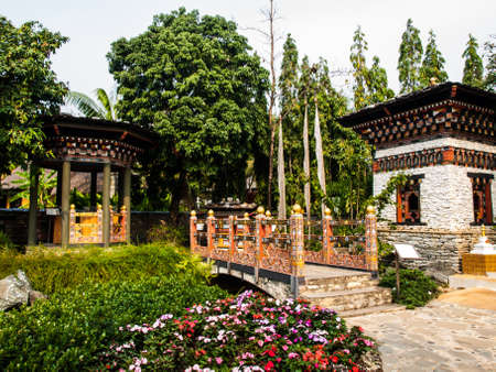 Bhutan traditional bridge and gazebo in gardenの写真素材