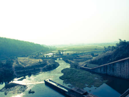 Canel and paddy field nearby Mae Suay reservoir, Chiang rai, Thailand: Filtered image:cross processed vintage effect.の写真素材