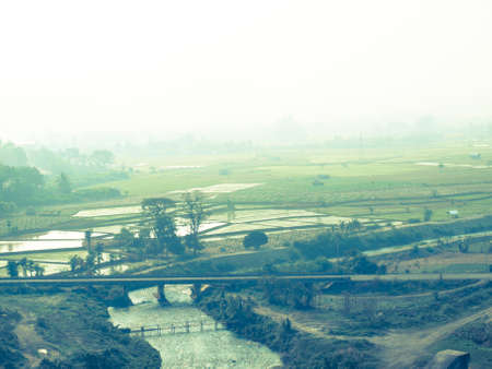 Canel and paddy field nearby Mae Suay reservoir, Chiang rai, Thailand: Filtered image:cross processed vintage effect.の写真素材