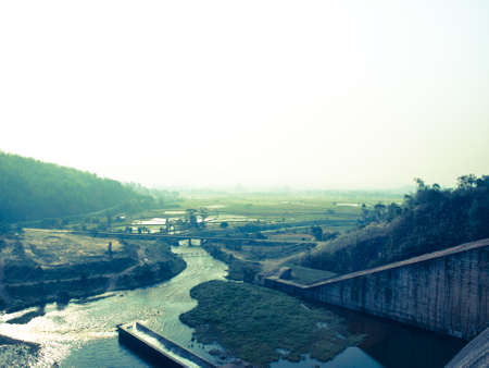 Canel and paddy field nearby Mae Suay reservoir, Chiang rai, Thailand: Filtered image:cross processed vintage effect.の写真素材