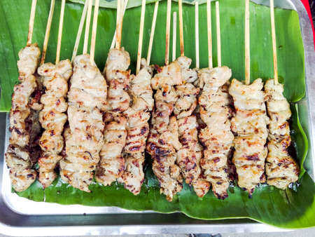 Delicious Asian Cuisine, traditional Thai Chicken Satay Cooking on banana leaves trayの写真素材