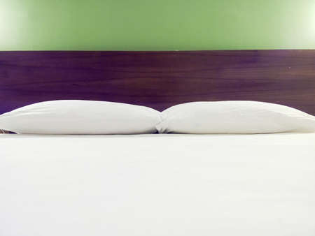 Modern double bedroom with king size bed and bedside tablesの写真素材