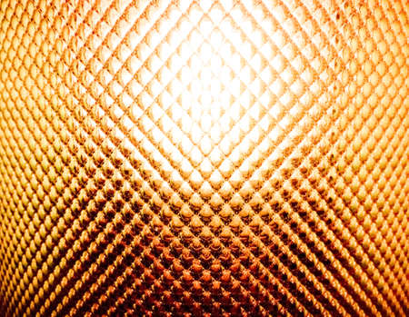 Yellow textured back lighted of glass lamp coverの写真素材