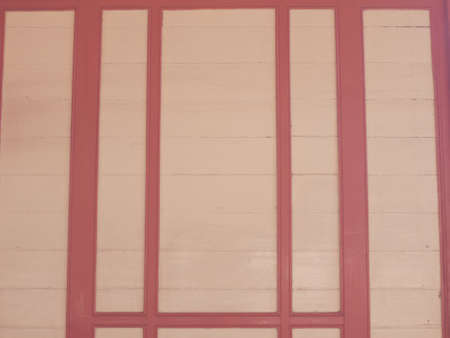 cream and red wooden panel in vintage styleの写真素材