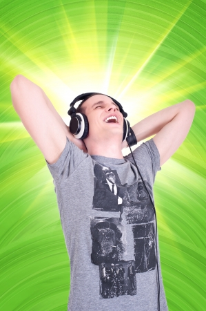 Portrait of a happy young man enjoying music with headphonesの写真素材