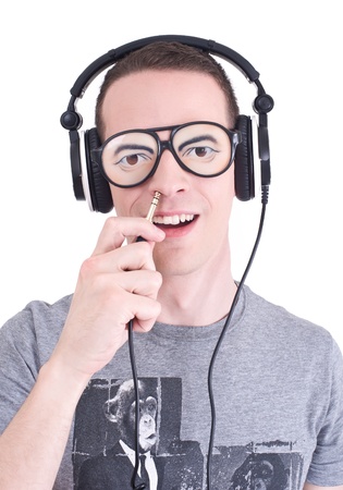 Funny DJ - Young man with headphones and stupid sunglasses  Studio shotの写真素材
