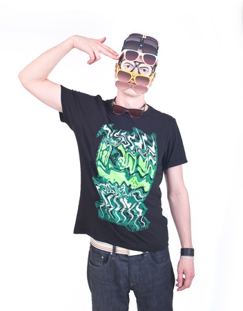 Funny boy with too many sunglasses on his head, shooting himself with his fingerの写真素材