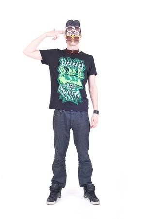 Funny boy with too many sunglasses on his head, shooting himself with his fingerの写真素材