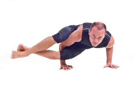 Practicing Yoga exercises   Eight Angle Pose - Astavakrasanaの写真素材