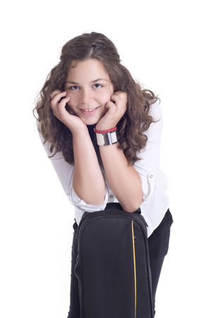 Teenage girl with trombone  Isolated on a white Studio shotの写真素材