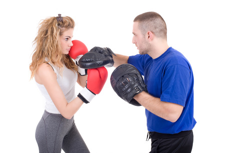 Kickboxing girl with trainer in sparring  Isolated on a white background  Studio shotの写真素材