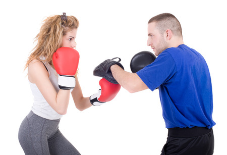 Kickboxing girl with trainer in sparring  Isolated on a white background  Studio shotの写真素材