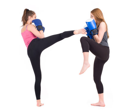 kickboxing girls fight  Isolated on a white background  Studio shotの写真素材