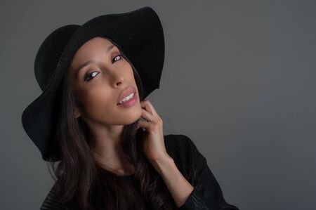 Hispanic fashion model posing at studio. Close up portrait.の写真素材
