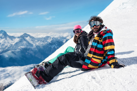 young couple enjoying winter mountains young couple enjoying wintertime nature, Les 2 Alpes, French Alps,の写真素材