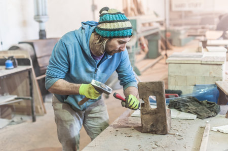 Carpenter work on wood plank in workshop