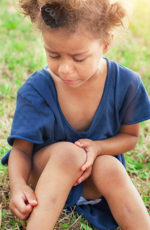 Portrait of little girl crying with tears rolling down her cheeksの写真素材