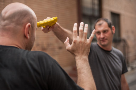 Kapap instructor demonstrates self defense techniques against a gun
