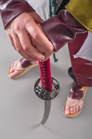 Japanese samurai with katana sword. Studio shoot. Isolatedの写真素材