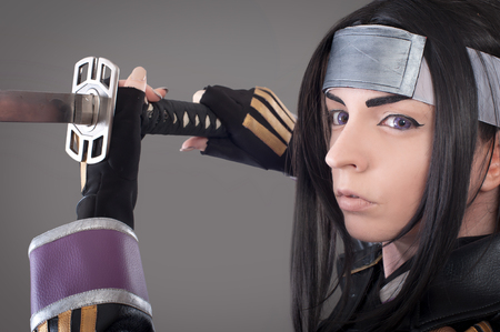 Japanese samurai with katana sword. Studio shoot. Isolatedの写真素材