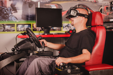 Man play the video game with virtual reality device