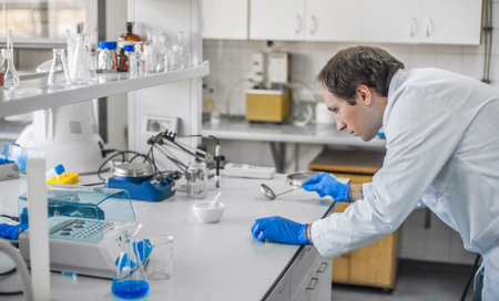 Male laboratory researcher performs tests in the medical or scientific lab