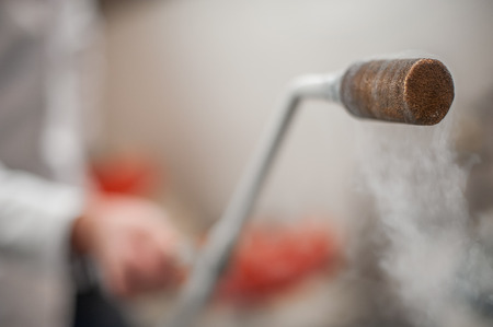 Smoking frozen pipe for liquid nitrogen. Close-upの写真素材