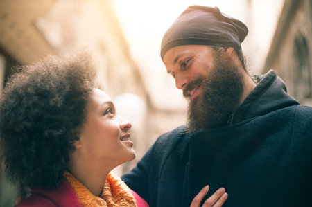 Portrait of romantic multiethnic couple in love hugging on the street. Valentines Day