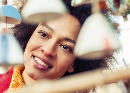 Portret of beautiful woman buying souvenirs in gift shopの写真素材