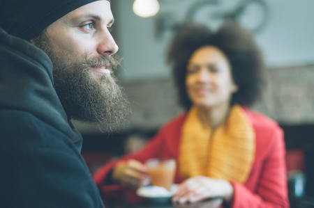 Portrait of beautiful couple enjoying tea in a restaurantの写真素材