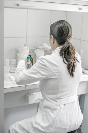 Young female doctor working in the laboratory. Close upの写真素材