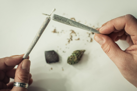 Mix of hashish and marijuana joint together. Drug use. Substance abuseの写真素材