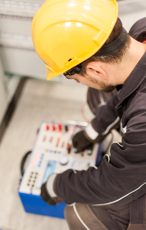 Maintenance engineer inspect system with relay test set equipment. Relay and protection testingの写真素材