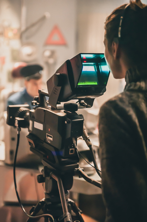 Behind the scene. Actor in front of the camera on the film set in film studio. Group movie sceneの写真素材