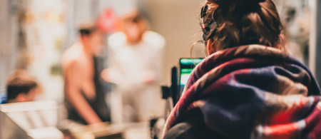 Behind the scene. Actor in front of the camera on the film set in film studio. Group movie sceneの写真素材