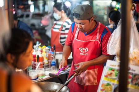 PHUKET, THAILAND - 10. MARCH 2018. An unidentified Asian vendor prepares food on the street. Pad Thai. Day editorial shotのeditorial素材