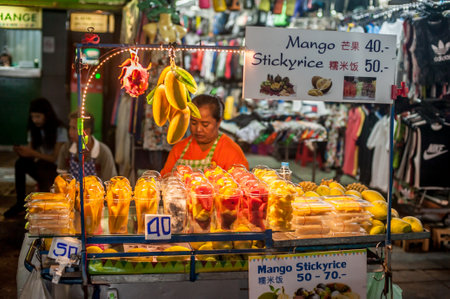 BANGKOK, THAILAND - 29. MARCH 2018. An unidentified Asian vendor selling tropical, exotic fresh fruit on the street. Day editorial shotのeditorial素材