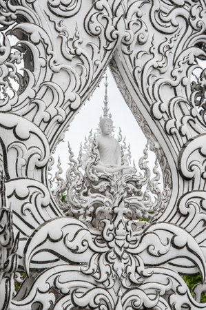 WAT RONG KHUN - WHITE TEMPLE, CHIANG RAI THAILAND - CIRCA MAY 2018. Buddha figure detail at contemporary Buddhist religious temple. Buddhism architectureのeditorial素材